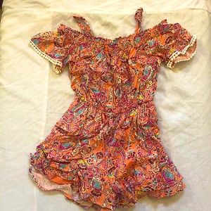 coral colored floral romper.